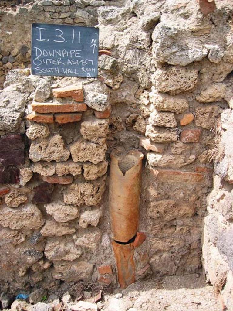 I.3.11 Pompeii. July 2008. Downpipe in north-east corner of small room on south side of bar-room. Photo courtesy of Barry Hobson.
