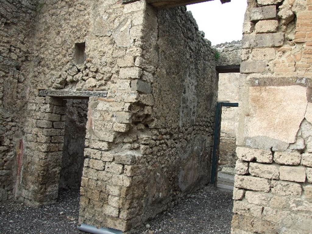 I.3.24 Pompeii. December 2006. Doorway to cubiculum or bedroom to west of entrance, and fauces or entrance corridor, looking north.