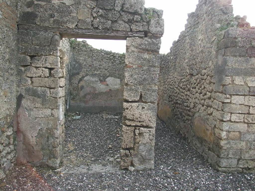 I.3.24 Pompeii. December 2006. Doorway to room on south side of atrium, and corridor to garden