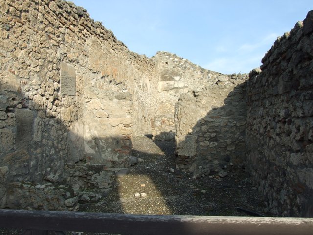 I.4.7 Pompeii. December 2018. 
Looking towards north-east corner with fullonica stalls against north wall, and doorway in east wall to another two rooms.
Photo courtesy of Aude Durand.
