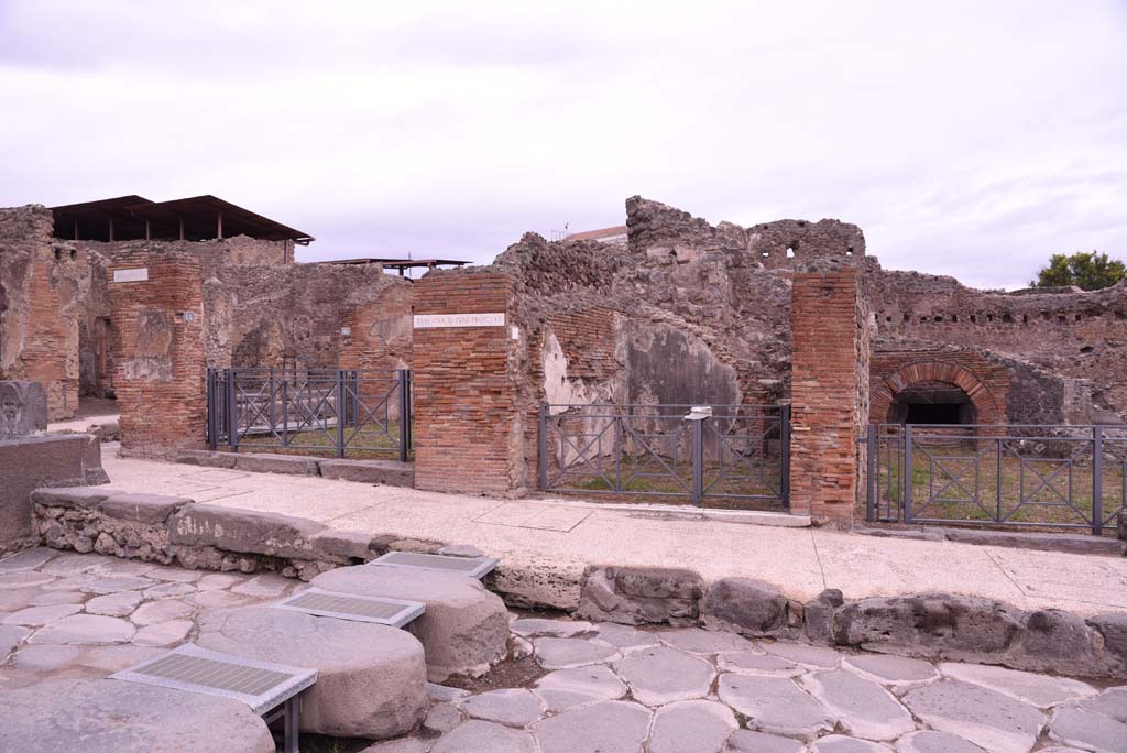 I.4.15, on left, I.4.14, in centre, and I.4.13, on right, Pompeii. October 2019. 
Looking towards east side of Via Stabiana at Holconius’ crossroads.       
Foto Tobias Busen, ERC Grant 681269 DÉCOR.
