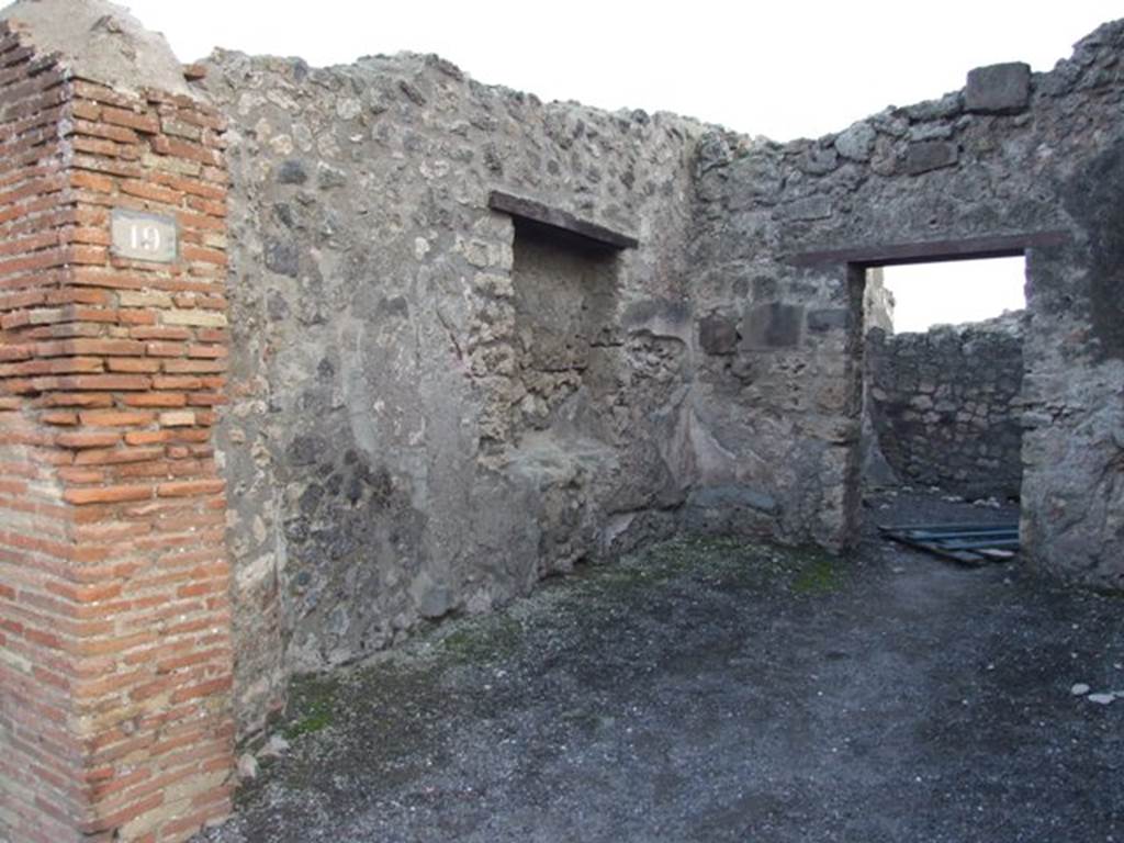 I.4.19 Pompeii. December 2007. East wall of shop, with site of base of steps to upper floor, in south-east corner.
