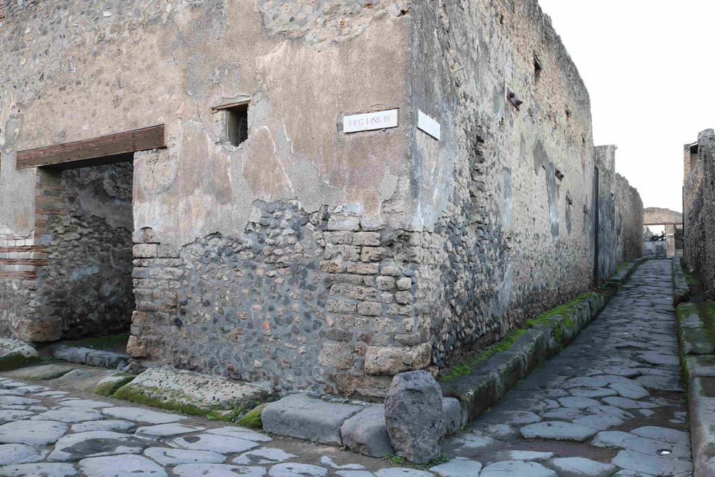 I.4.28 Pompeii. December 2018. Entrance doorway on Vicolo del Menandro and south-east corner of Ins. 4 of Reg. I. 
The east wall is in Vicolo del Citarista. Photo courtesy of Aude Durand.



