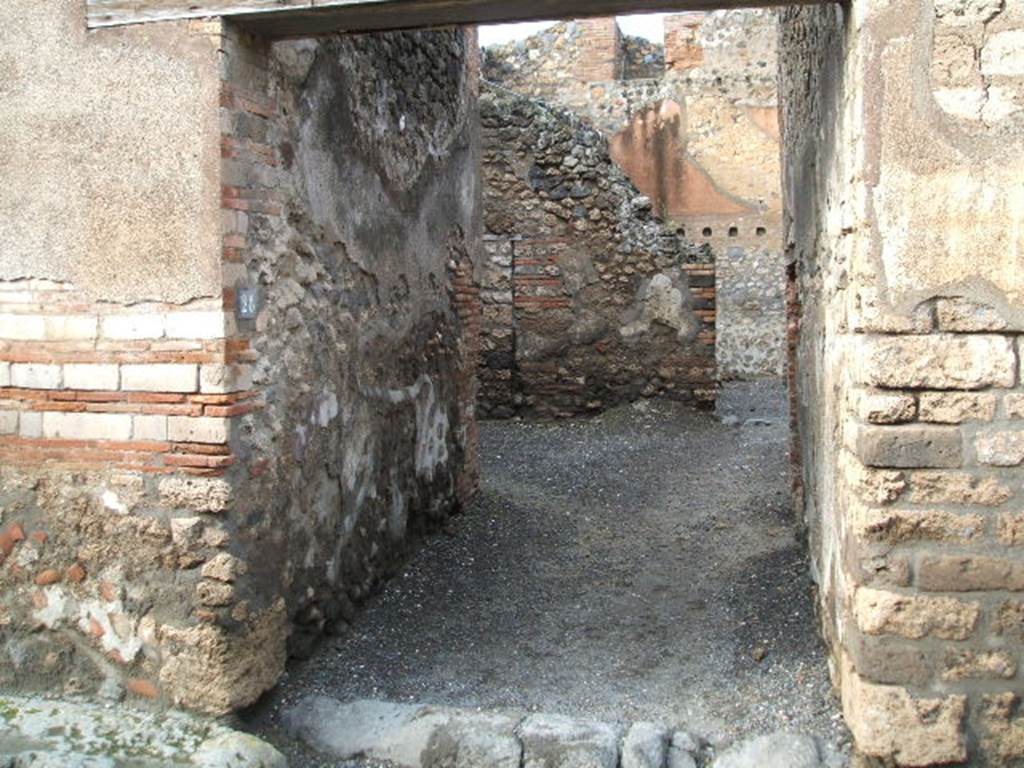 I.4.28 Pompeii. December 2007. Entrance, looking north.
When first excavated, there was a painted graffito written in red on the left pilaster of the entrance doorway -
Cn(aeum)  Helvium
Sabinum  aed(ilem)  o(ro)  v(os)  f(aciatis)
L  Ceium  Secundum  IIvir(um)  o(ro)  v(os)  f(aciatis)
Recepta nec  sine thalamo   (CIL IV 1083)
See Pagano, M. and Prisciandaro, R., 2006. Studio sulle provenienze degli oggetti rinvenuti negli scavi borbonici del regno di Napoli. Naples: Nicola Longobardi. (p.169)
According to Cooley,
I beg you to elect Cn. Helvius Sabinus aedile and L. Ceius Secundus duumvir, Recepta and also Thalamus. (CIL IV 1083)
See Cooley, A. and M.G.L., 2004. Pompeii: A Sourcebook. London: Routledge. (p. 124, F67)

Della Corte said this part of the grand house was the rustic part, containing the stables and the dormitories for servants.
This dwelling was possibly under the vigilance of a procurator (or manager) called Thalamus, and his companion called Recepta.
He said the recommendation was found to the right of the entrance.
See Della Corte, M., 1965.  Case ed Abitanti di Pompei. Napoli: Fausto Fiorentino. (p. 266)

Also Cooley says somewhere on the wall of the south side of the insula I.4, the following recommendation was found:
Helvium
Sabinum
aed(ilem) Dormis    [CIL IV 2993t]
She translates this as 
Wake up and vote for Helvius Sabinus for aedile   (CIL IV 2993t)
See Cooley, A. and M.G.L., 2004. Pompeii: A Sourcebook. London: Routledge. (p.124, F71)

