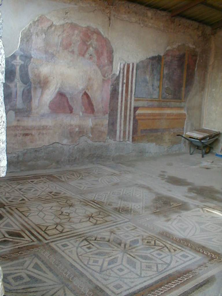 I.6.4 Pompeii. December 2005. Room 11, Room of the Elephants – showing fine mosaic floor and painting on east wall.

 
