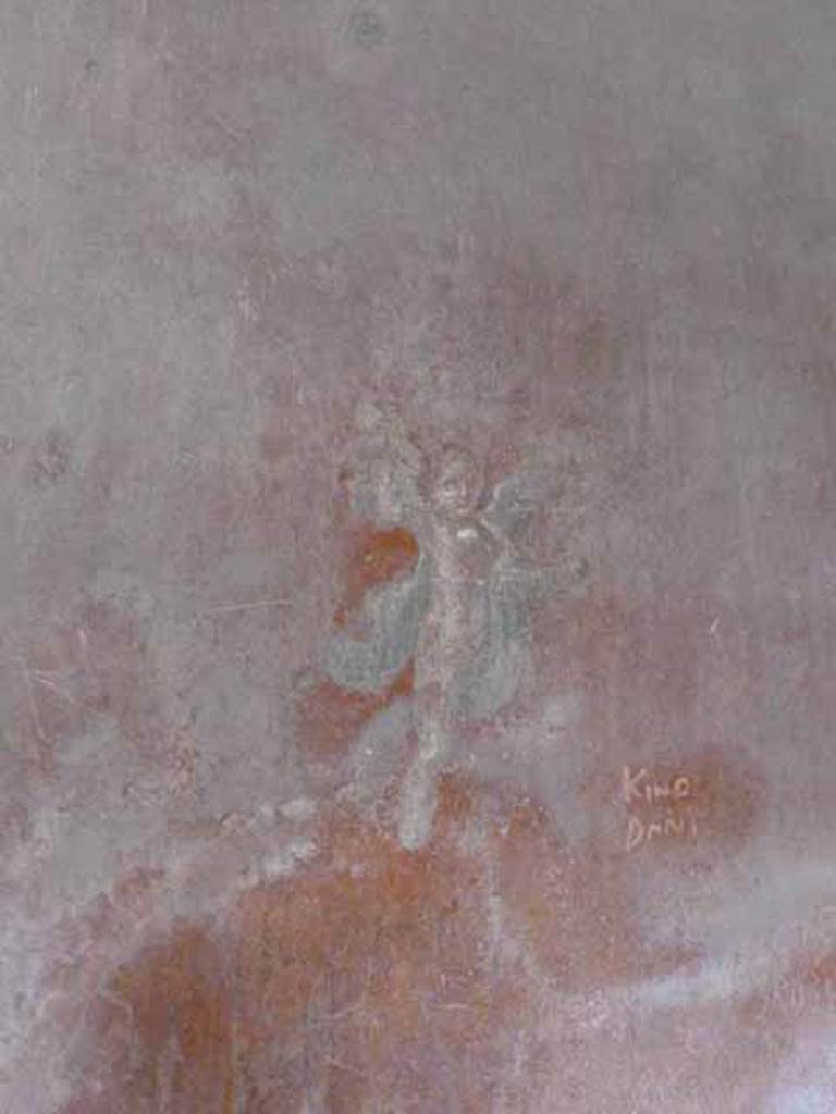 I.6.7 Pompeii. May 2010. Painted flying cupid at south end of east wall.