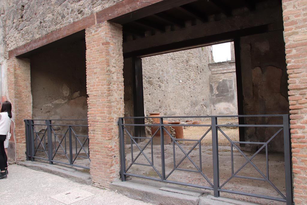 I.6.9 Pompeii. May 2024. Looking south-east towards entrance doorways, with I.6.9, on right. Photo courtesy of Klaus Heese.