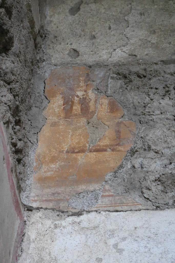 I.6.10 Pompeii. December 2018. 
Detail of remaining plaster on east end of south wall. Photo courtesy of Aude Durand.

