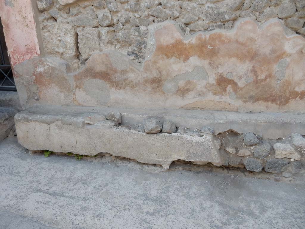 I.6.15 Pompeii. June 2019. Bench on east side of entrance doorway, west end. Photo courtesy of Buzz Ferebee.