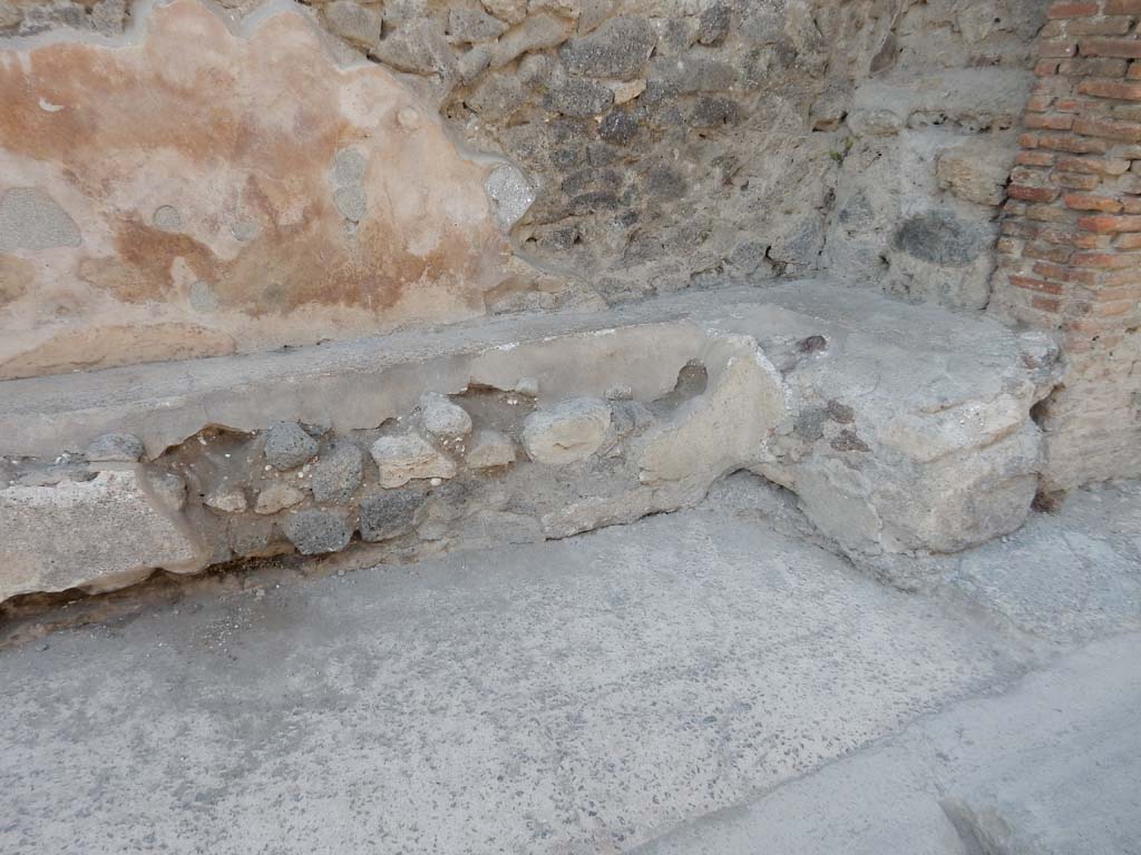 I.6.15 Pompeii. June 2019. Bench on east side of entrance doorway, east end. Photo courtesy of Buzz Ferebee.
