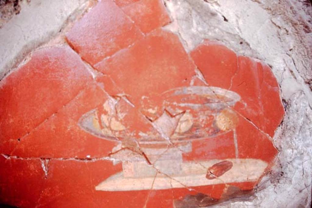 I.7.1 Pompeii, 1968.  Detail of painted vignette of glass vase/dish and fruit, on east wall of atrium.
Photo by Stanley A. Jashemski.
Source: The Wilhelmina and Stanley A. Jashemski archive in the University of Maryland Library, Special Collections (See collection page) and made available under the Creative Commons Attribution-Non Commercial License v.4. See Licence and use details.
J68f0452
