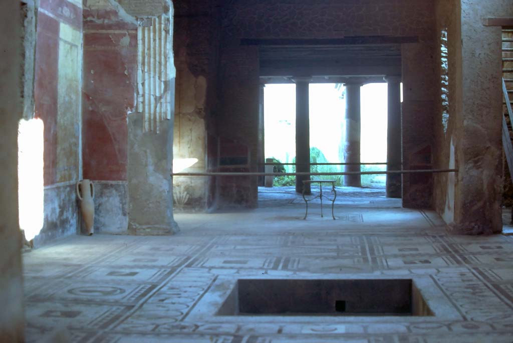 I.7.1 Pompeii. August 1976. Looking south across atrium towards tablinum, oecus and peristyle.
Photo courtesy of Rick Bauer, from Dr George Fays slides collection.

