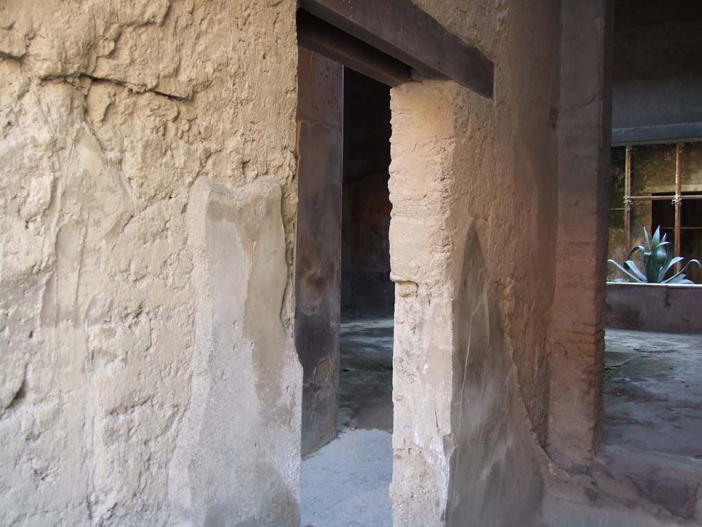 I.7.2 Pompeii. December 2007. Stairway to upper floor at front. Looking south to doorway in east wall, leading to corridor of I.7.3.