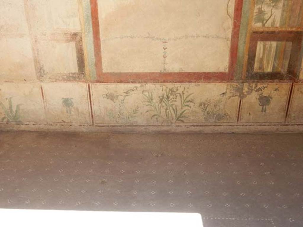 I.7.11 Pompeii. May 2017. Detail of zoccolo (lower wall) of east wall, with painted plants. Photo courtesy of Buzz Ferebee.
