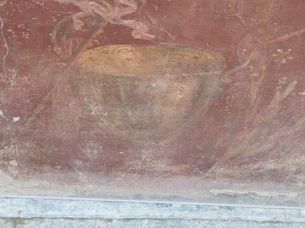 I.8.1 Pompeii. May 2010.  Painted decoration on counter front. Goblet on east end.