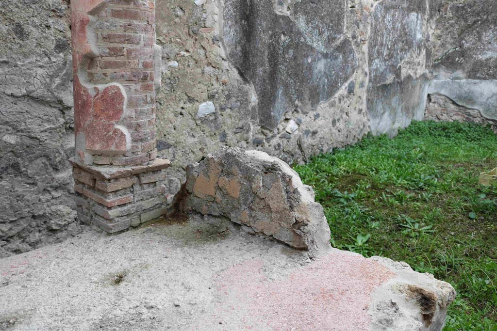 I.8.9 Pompeii. December 2018. 
Looking south-west from interior end of southern couch which also appears to have yellow plaster on. Photo courtesy of Aude Durand.
