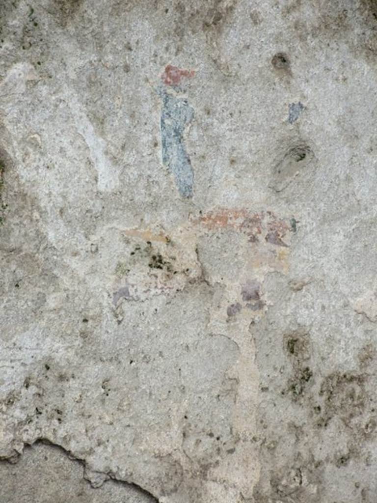 I.8.10 Pompeii.  March 2009.  Area on east side of niche.  Remains of painting of a Lar.  There was one lar on either side of the niche.  See Fröhlich, T., 1991. Lararien und Fassadenbilder in den Vesuvstädten. Mainz: von Zabern. (L9: p.253, T25.2).