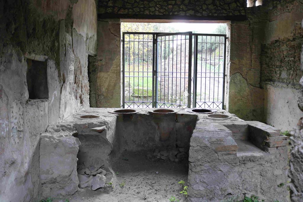 I.8.15 Pompeii. December 2018. Looking south across bar-counter from rear towards entrance doorway. Photo courtesy of Aude Durand.