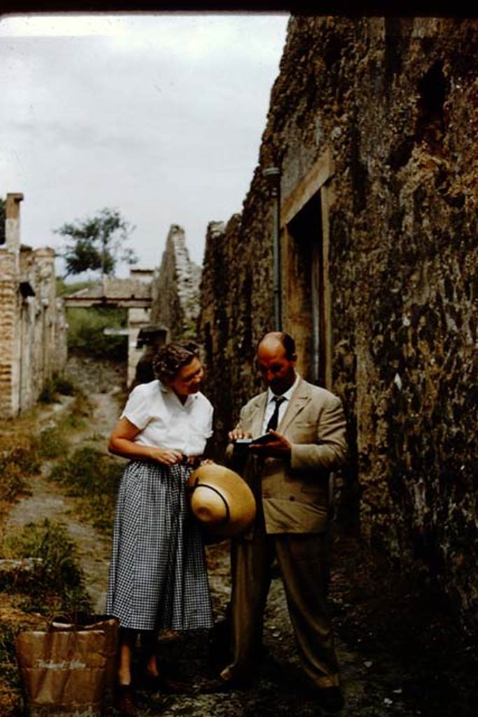 I.8.19 Pompeii. 1959. Wilhelmina and colleague outside entrance.
Vicolo dell’Efebo, looking north towards Via dell’Abbondanza. 
Photo by Stanley A. Jashemski.
Source: The Wilhelmina and Stanley A. Jashemski archive in the University of Maryland Library, Special Collections (See collection page) and made available under the Creative Commons Attribution-Non-Commercial License v.4. See Licence and use details.
J59f0494
