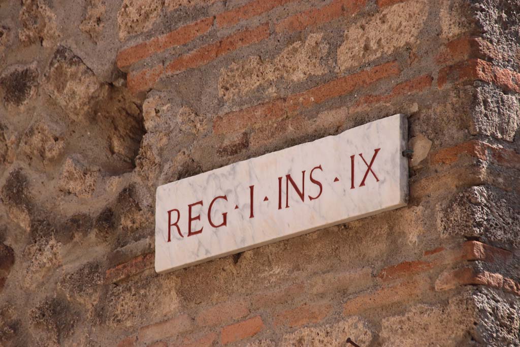 I.9.1 Pompeii. September 2019. Insula identification plaque on upper wall. Photo courtesy of Klaus Heese.