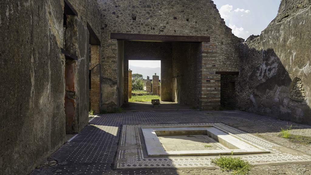 I.9.1 Pompeii. August 2021. Room 2, looking south across impluvium in atrium towards tablinum. Photo courtesy of Robert Hanson.