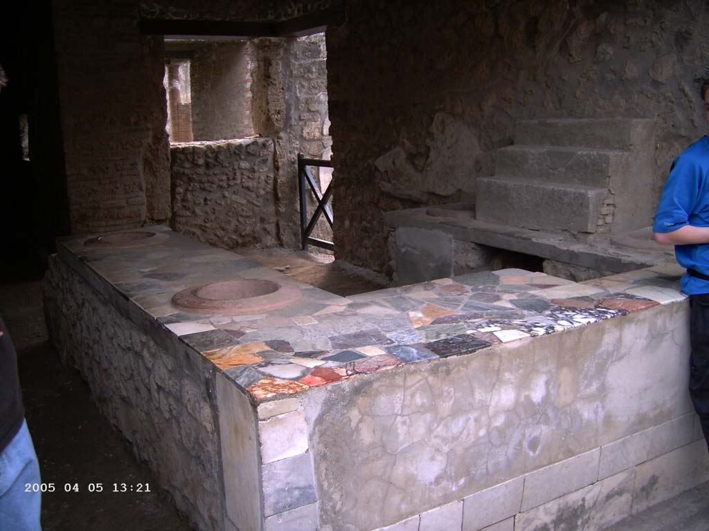 I.9.4 Pompeii. April 2005. Looking south-west across podium/counter. Photo courtesy of Klaus Heese.