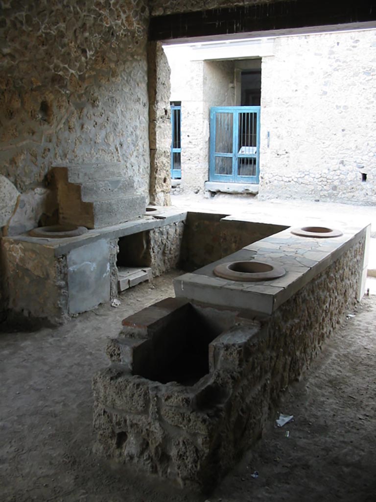 I.9.4 Pompeii. May 2003. Looking north-west across rear of counter. Photo courtesy of Nicolas Monteix.