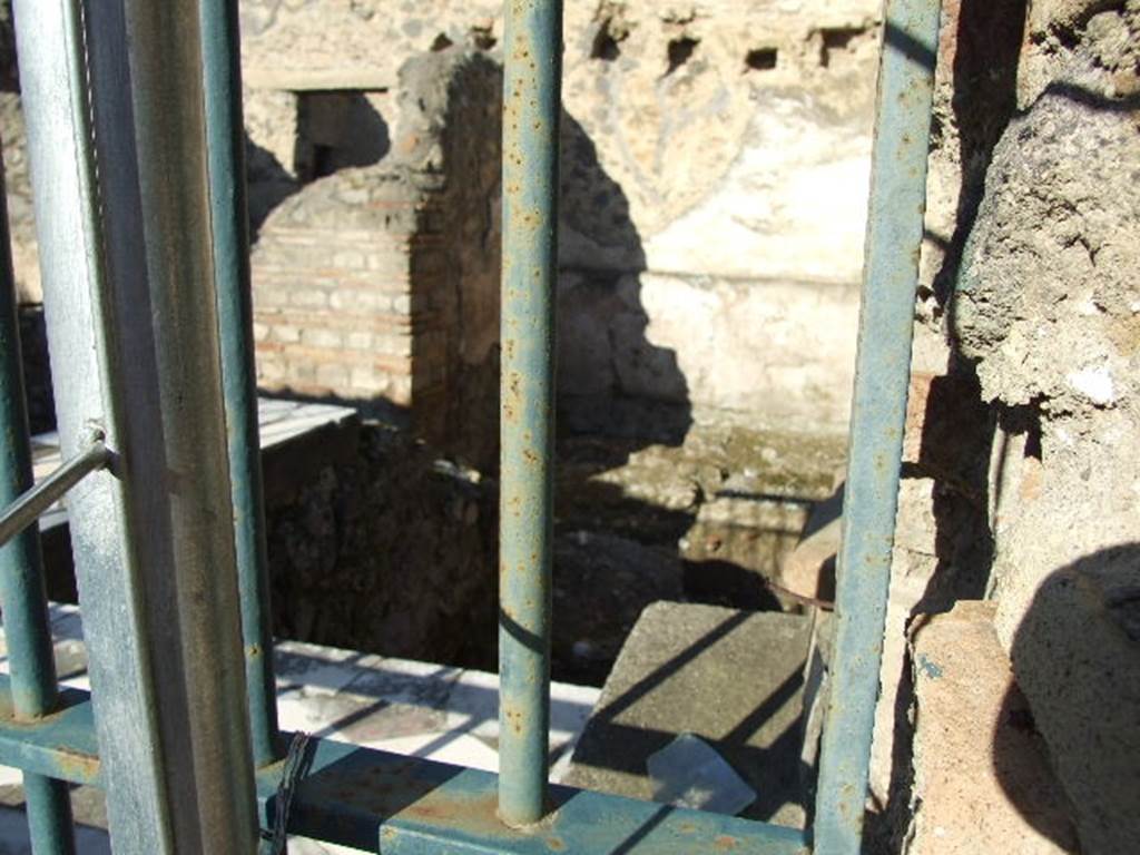 I.9.11 Pompeii.  December 2006.  Counter and rear east room.