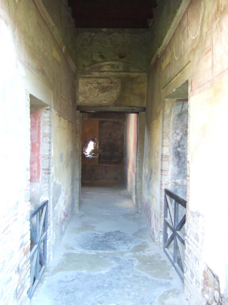 I.10.4 Pompeii. May 2006. Corridor 16, looking east to room 17.