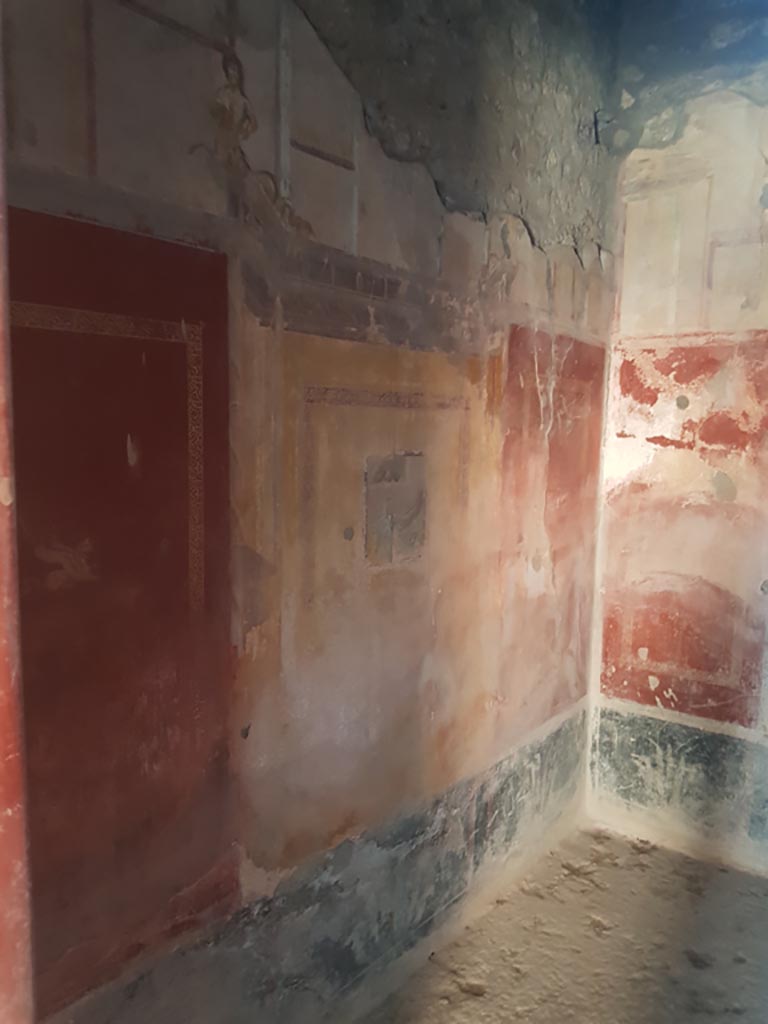 I.10.11 Pompeii. October 2022. 
Room 9, looking west along south wall from entrance doorway. Photo courtesy of Klaus Heese. 
