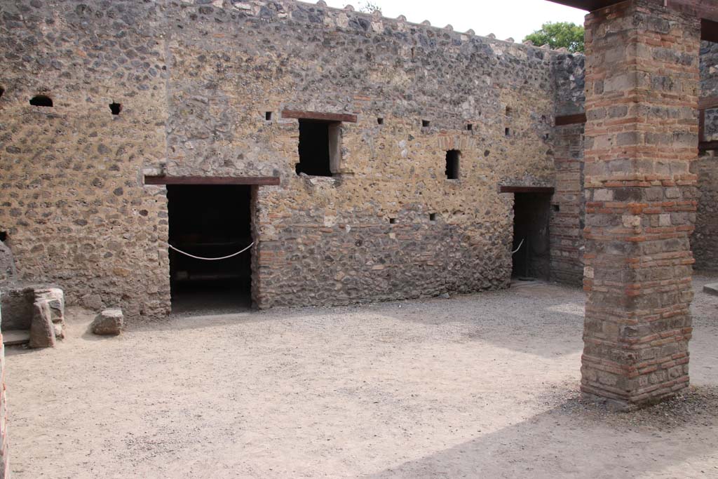 I.10.14 Pompeii. September 2021. Looking towards south wall, with doorway to storeroom, on left. Photo courtesy of Klaus Heese.