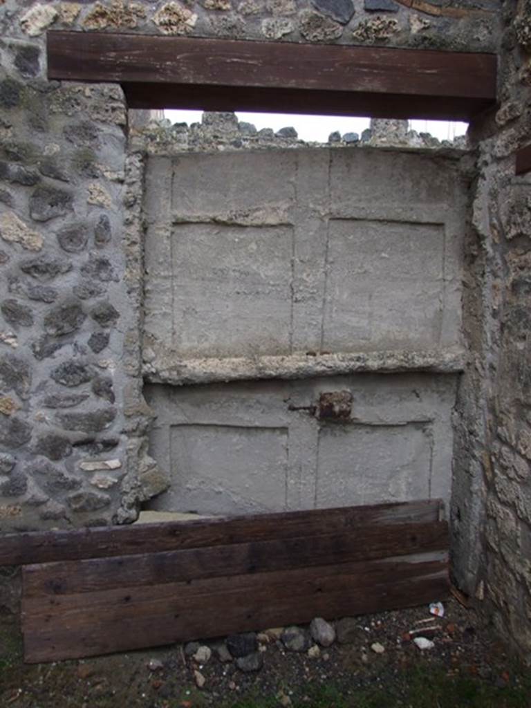 I.11.9 Pompeii. May 2005. Plastercast of original door as seen from inside house.