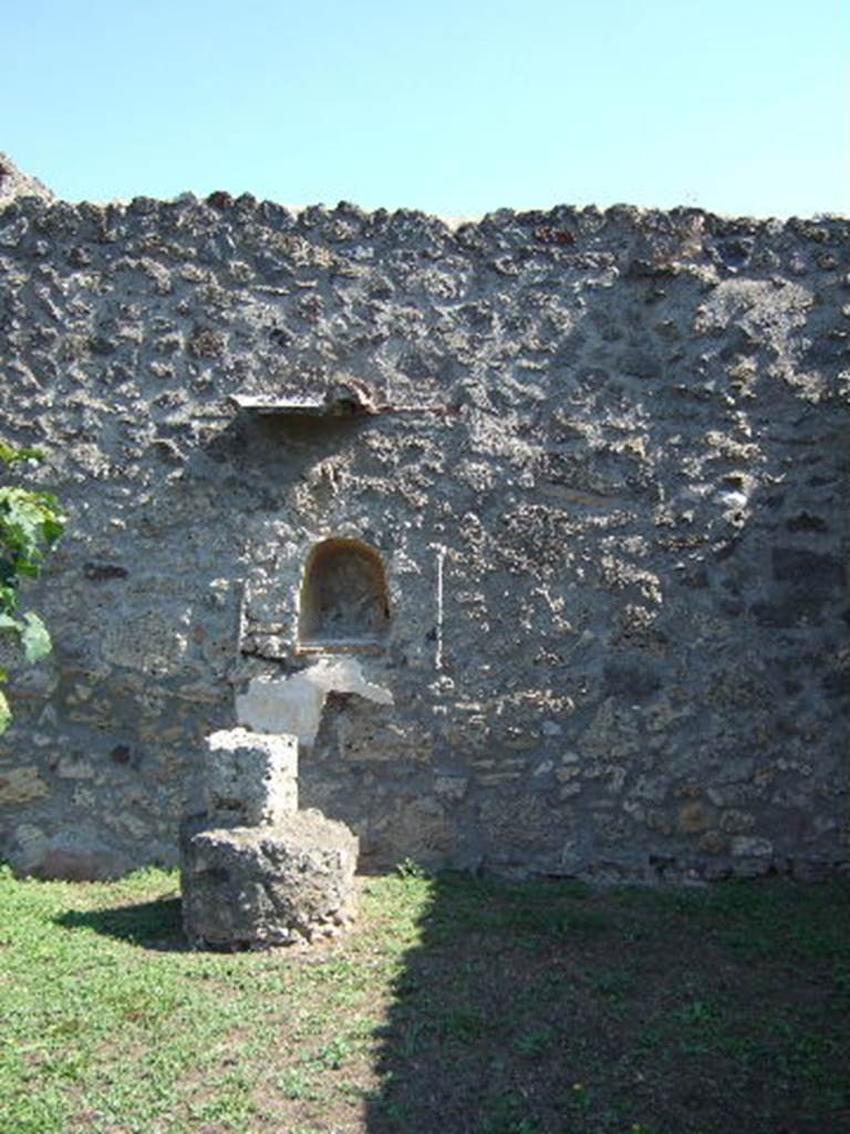 I.11.10 Pompeii. September 2005. Aedicula lararium on the east wall.

