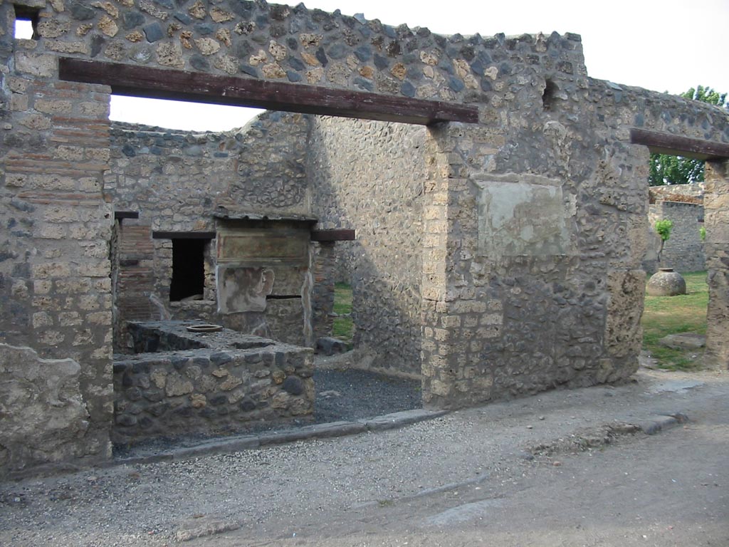 I.11.11 Pompeii, on left, and I.11.10, on right. May 2003. 
Looking north-east towards entrance doorways. Photo courtesy of Nicolas Monteix.
