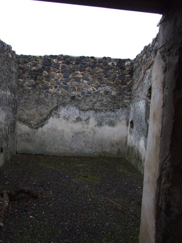 I.11.16 Pompeii. December 2007.  Doorway to room 8, looking east. According to Packer, this may have been a winter triclinium or an oecus. The walls were painted with plain white stucco.
