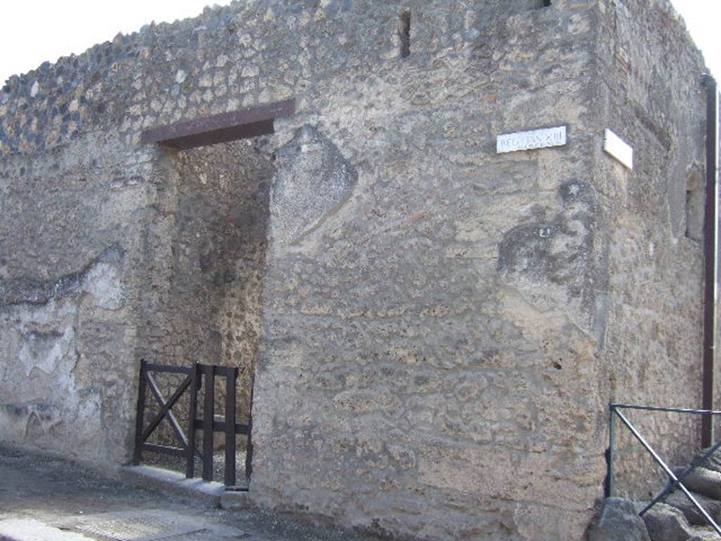 Street wall outside of I.13.1 on Via dell’Abbondanza. December 2007.
According to Della Corte, two electoral recommendations were found written on both sides of the entrance –
Crescens rog(at)   [CIL IV 7448]
Crescens cupidus rog(at)    [CIL IV 7455]
He thought these proved the owner of the house was probably a Crescens (and most likely Crassius).
There was a third recommendation written to the left of entrance number l.13.3 –  Crescens rog(at)    [CIL IV 7462]  See Della Corte, M., 1965.  Case ed Abitanti di Pompei. Napoli: Fausto Fiorentino. (p.355)
According to Epigraphik-Datenbank Clauss/Slaby (See www.manfredclauss.de), these read as -
L(ucium)  Ovidium 
aed(ilem)  Crescens  rog(at)      [CIL IV 7448]
Trebium  et  Rufum 
aed(iles)  o(ro)  v(os)  Crescens  cupidus  rog(at)      [CIL IV 7455]
Cn(aeum)  Helvium  Sabin(um) 
aed(ilem)  Crescens  rog(at)       [CIL IV 7462]
