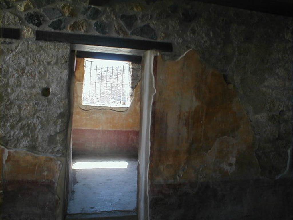 I.13.9 Pompeii. May 2005. West painted wall of atrium, and doorway to triclinium.