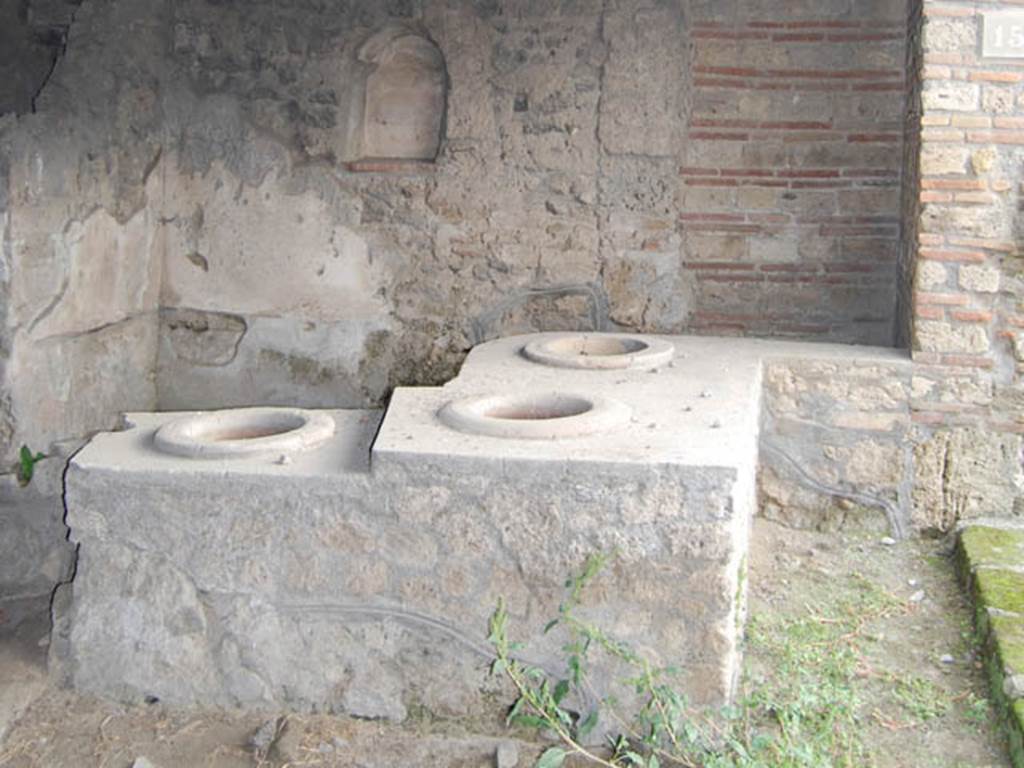 I.14.15 Pompeii. October 2013. Looking east towards counter, and east wall with niche.
Photo courtesy of Paula Lock.
