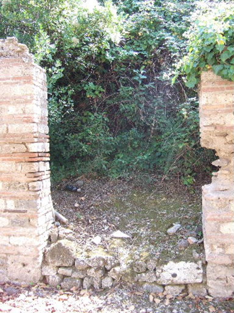 I.19.1 Pompeii. September 2005. Entrance doorway, looking south.
According to Hunink, graffito naming Actius was found on the counter of I.11.2 [=I.19.2]
<B=H>onus deus hic (h)abitat in do/mo / Act(i)      [CIL IV, 8417]
He translates this as “A good god lives here in the house of Actius”.
See Hunink, V., 2011. Glücklich ist dieser Ort!: 1000 Graffiti aus Pompeji. Stuttgart: Philipp Reclam, p. 60 no. 101.
