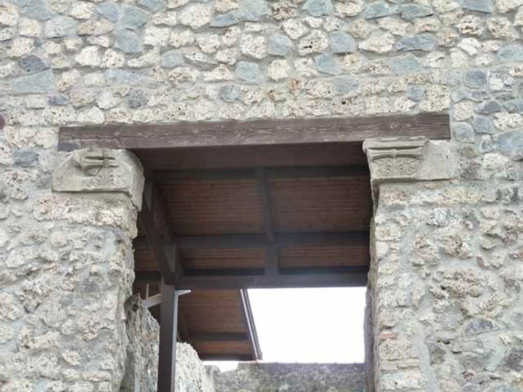 I.20.4 Pompeii. May 2010. Upper entrance doorway with capitals.