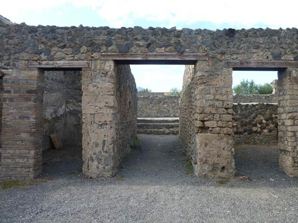 I.21.2 Pompeii. September 2015. 
Looking north across atrium, towards entrance doorway, in centre, leading out onto Via della Palestra.


