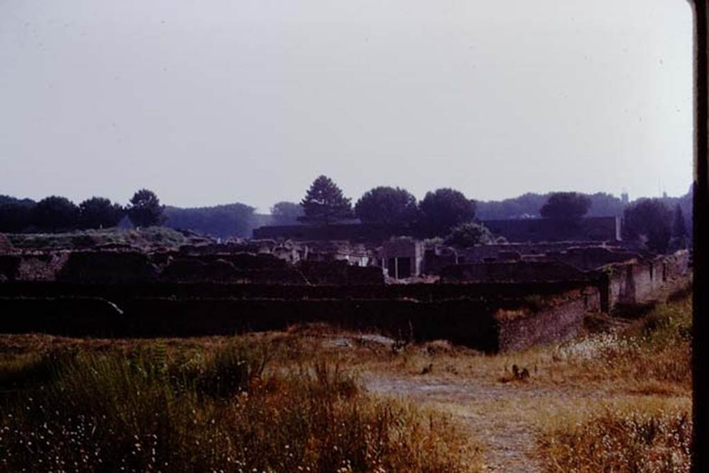 I.22 Pompeii. 1972.  Looking east from I.22, across south side of I.21 and I.20.  Photo by Stanley A. Jashemski. 
Source: The Wilhelmina and Stanley A. Jashemski archive in the University of Maryland Library, Special Collections (See collection page) and made available under the Creative Commons Attribution-Non Commercial License v.4. See Licence and use details. J72f0058

