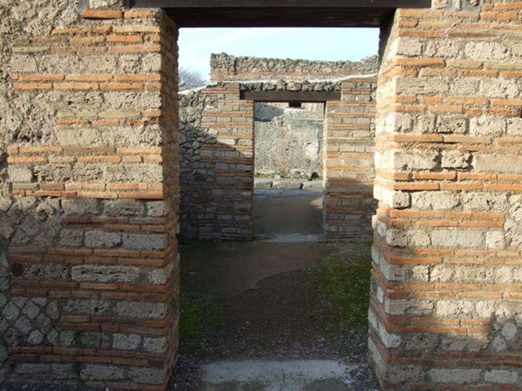 II.1.4 Pompeii.   December 2007.  Looking north across middle room to entrance room on Via dell’ Abbondanza.
