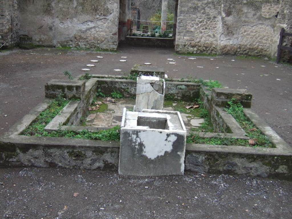 II.2.2 Pompeii. December 2005. Room 2, atrium. Looking south across atrium, impluvium and fountain. According to Jashemski, Spinazzola said the space between the walls had been lined in wood and would have formed a permanent planting box. The impluvium had been bordered by a low, double masonry wall, covered with marble on the outside. See Jashemski, W. F., 1993. The Gardens of Pompeii, Volume II: Appendices. New York: Caratzas. (p.78)


