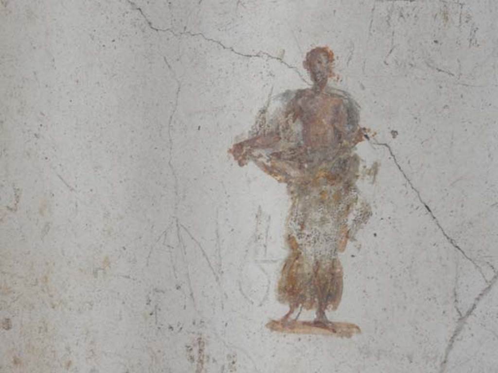 II.2.2 Pompeii. May 2016. Room “f”, painted figure in centre of panel at east end of south wall. Photo courtesy of Buzz Ferebee.
