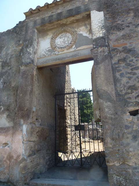 II.2.4 Pompeii. June 2012. Looking towards west side of entrance doorway, with plaster cast of remaining doorway. Photo courtesy of Michael Binns.
