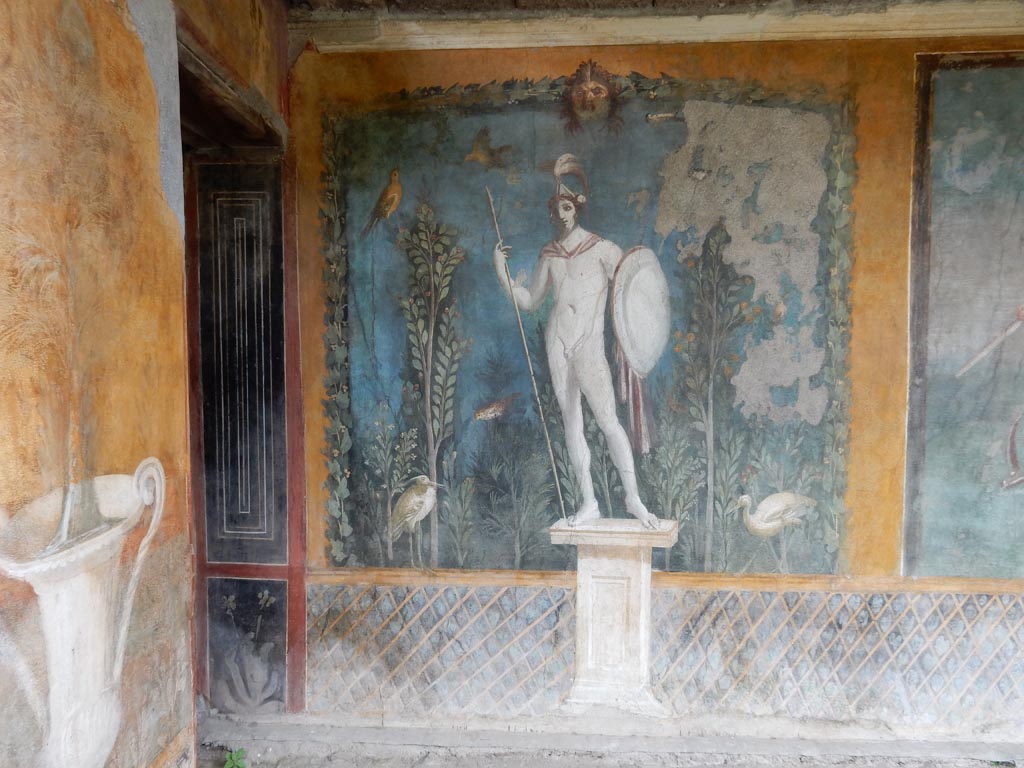 II.3.3 Pompeii. May 2016. Room 11, east panel on south wall of peristyle. 
Wall painting of statue of naked Ares / Mars with a lance and shield. Photo courtesy of Buzz Ferebee. 
