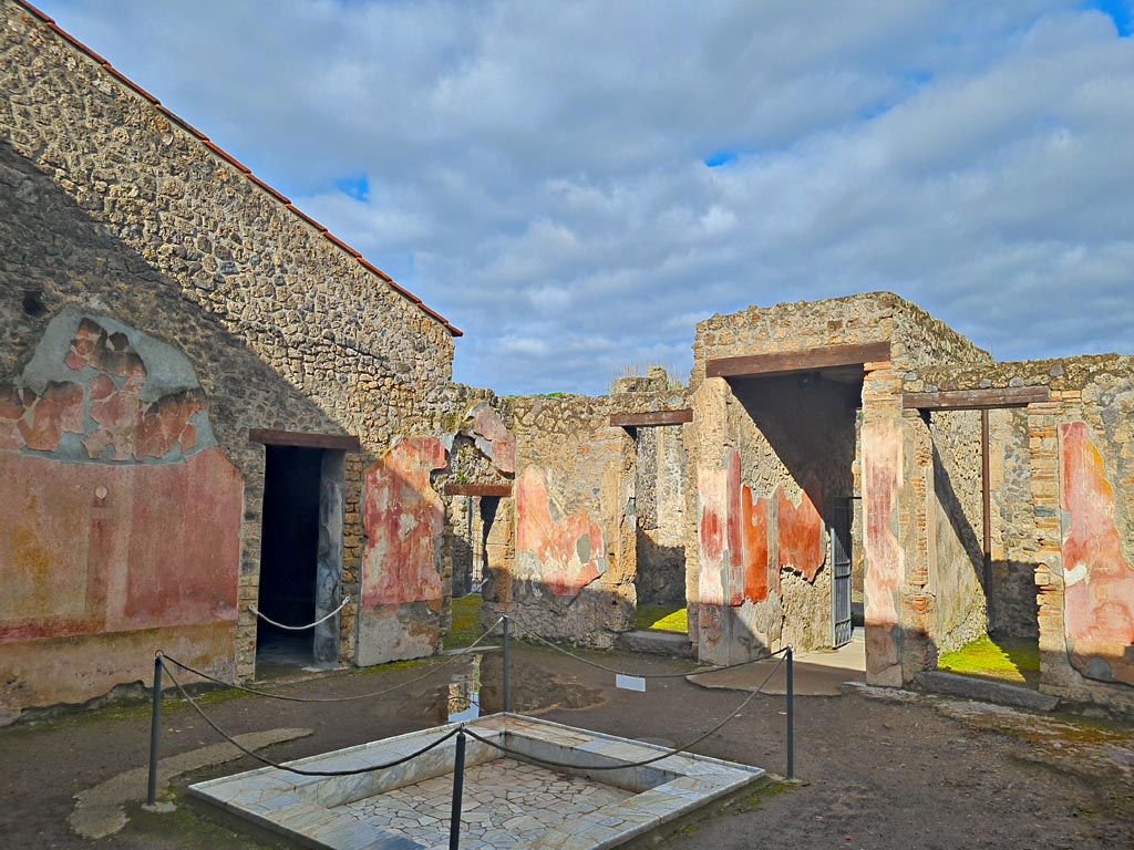 II.3.3 Pompeii. March 2024. 
Room 2, looking across impluvium in atrium towards north-west corner. Photo courtesy of Giuseppe Ciaramella.

