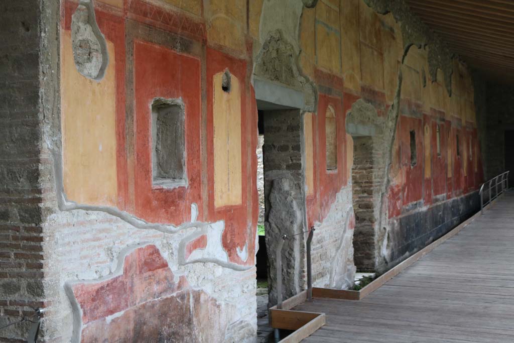 II.4.6 Pompeii. December 2018. 
Looking north along west wall of portico from doorway on north side of summer triclinium. Photo courtesy of Aude Durand.
