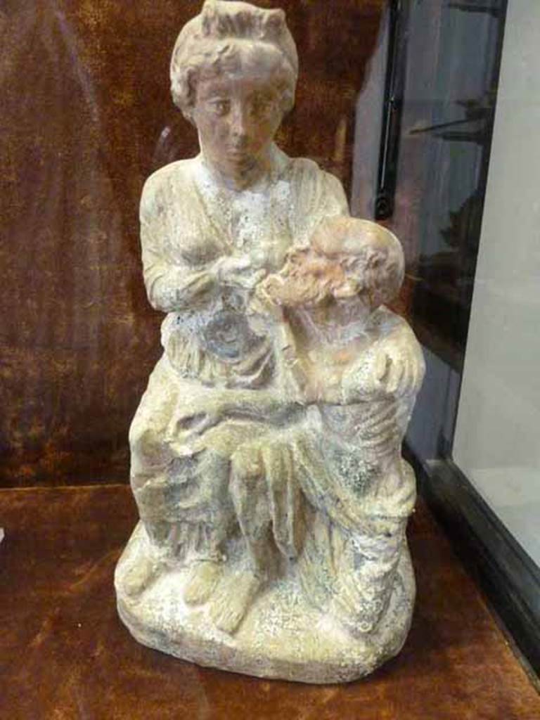 II.4.6 Pompeii. Found in several fragments in the garden. Terracotta statuette labelled Gruppi figurati con Perona e Micone. Now in Naples Archaeological Museum. This seems to match the illustration by Rohden of The Carita Romana or Roman Charity.
